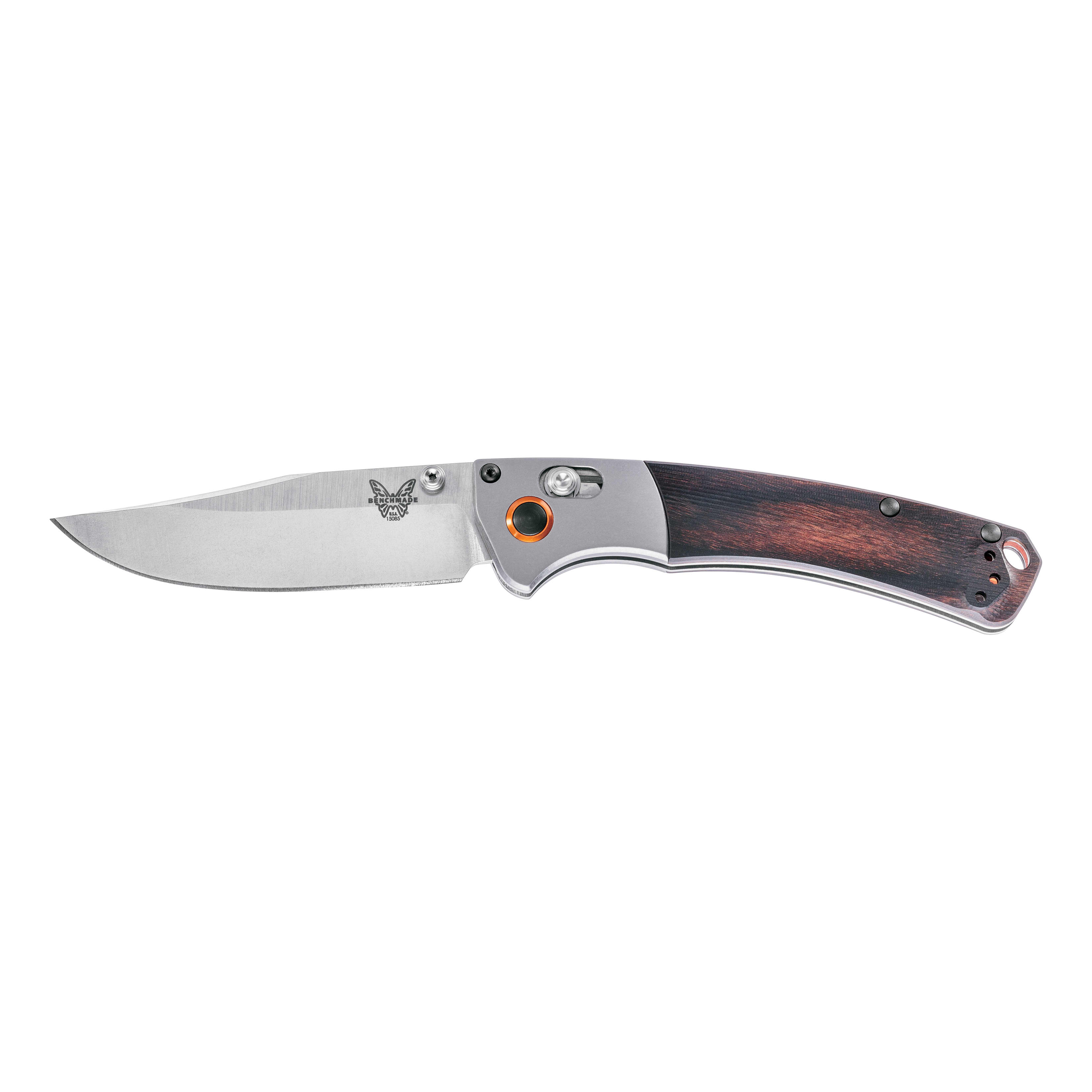 Buck 110 traditional hunting knife, sitting next to headless fish